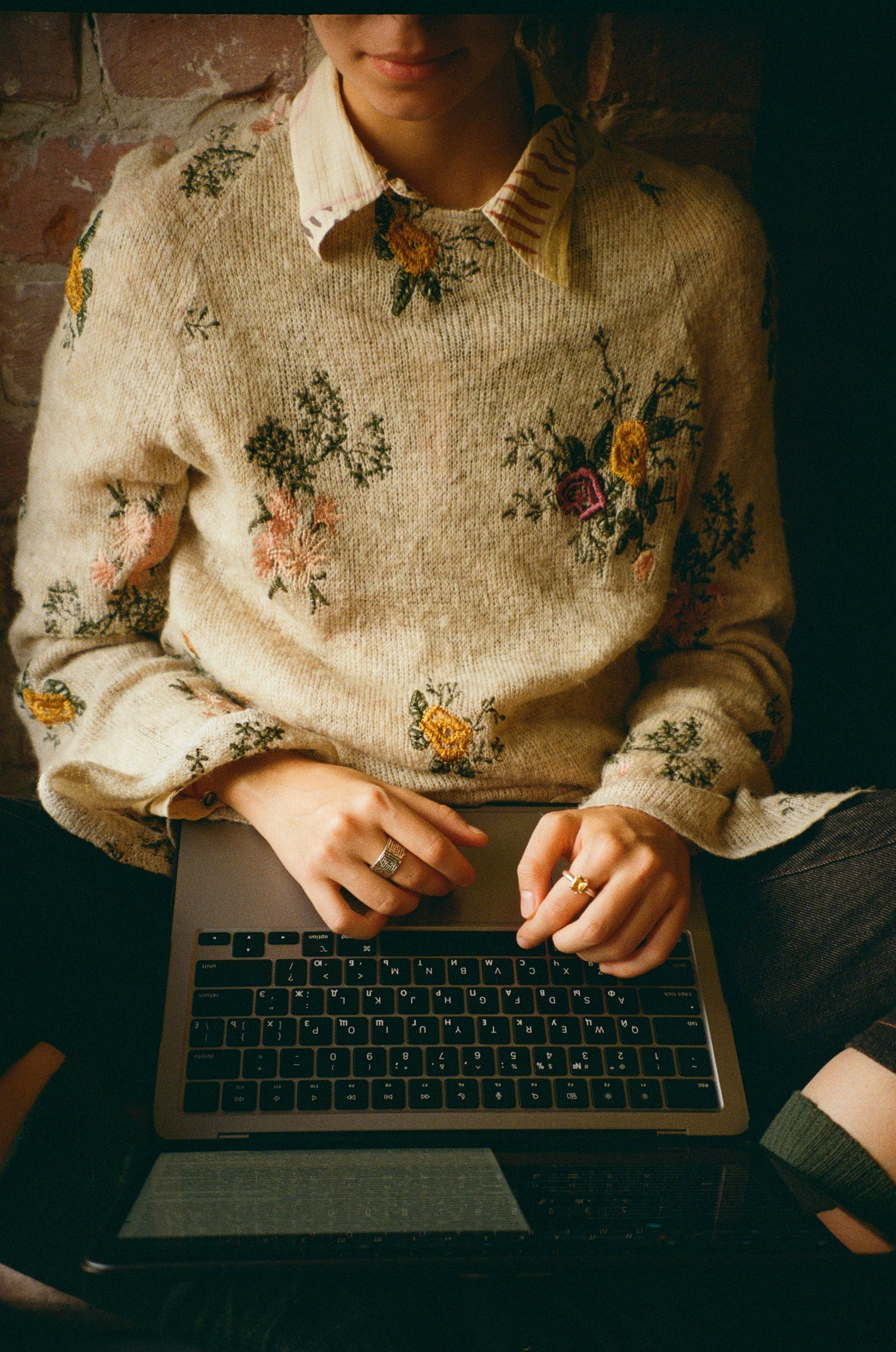 Professional working on a laptop answering frequently asked questions